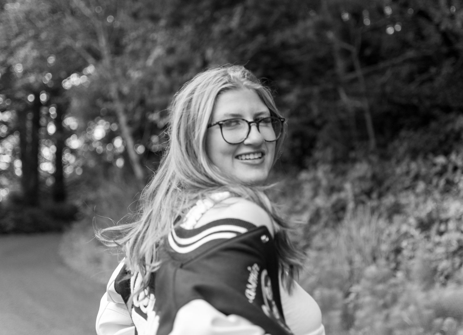 Jasmin poses casually for her Newport Oregon senior pictures.