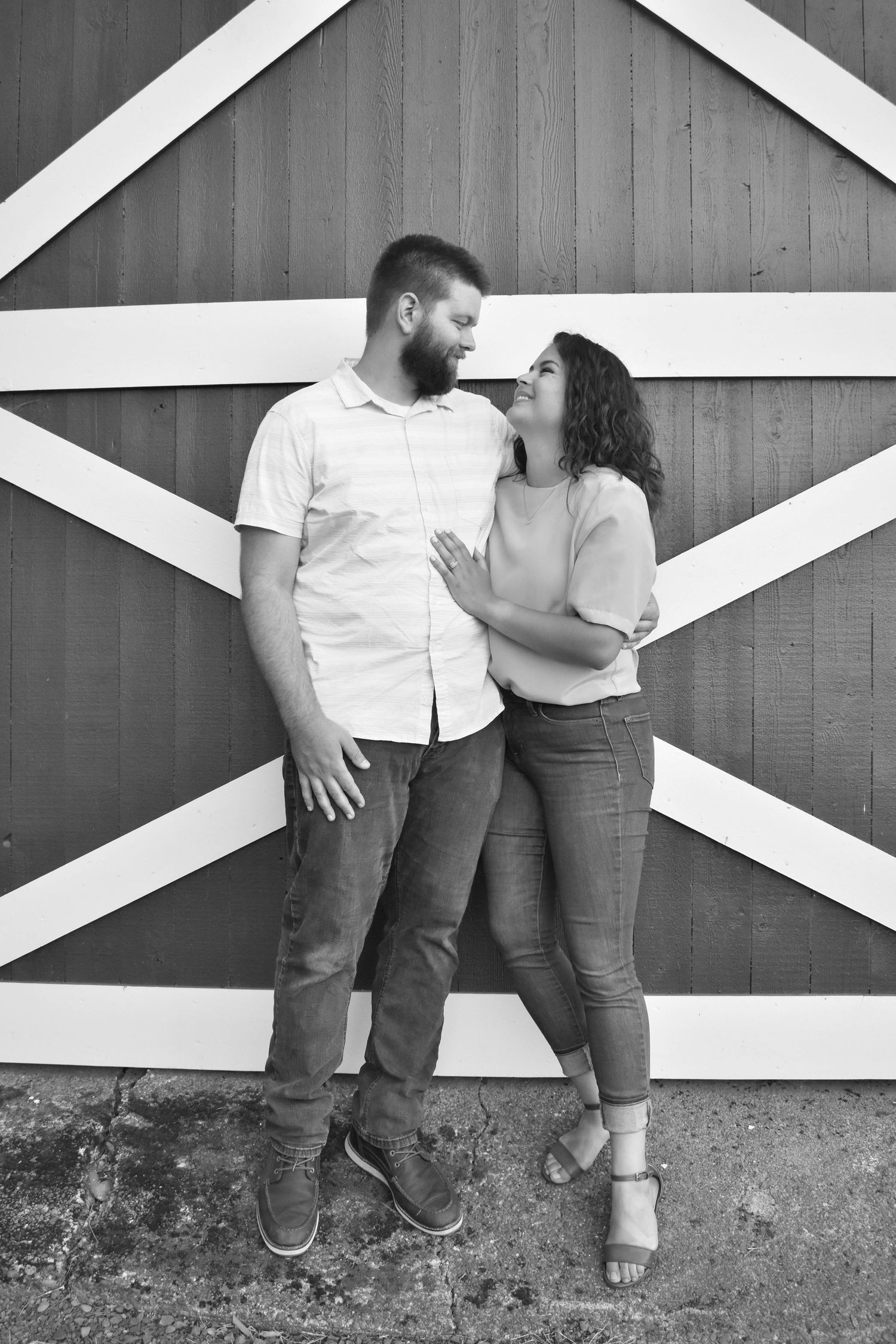 Couple standing in front of a barn at William L. Finley National Wildlife Refuge in Corvallis Oregon.
