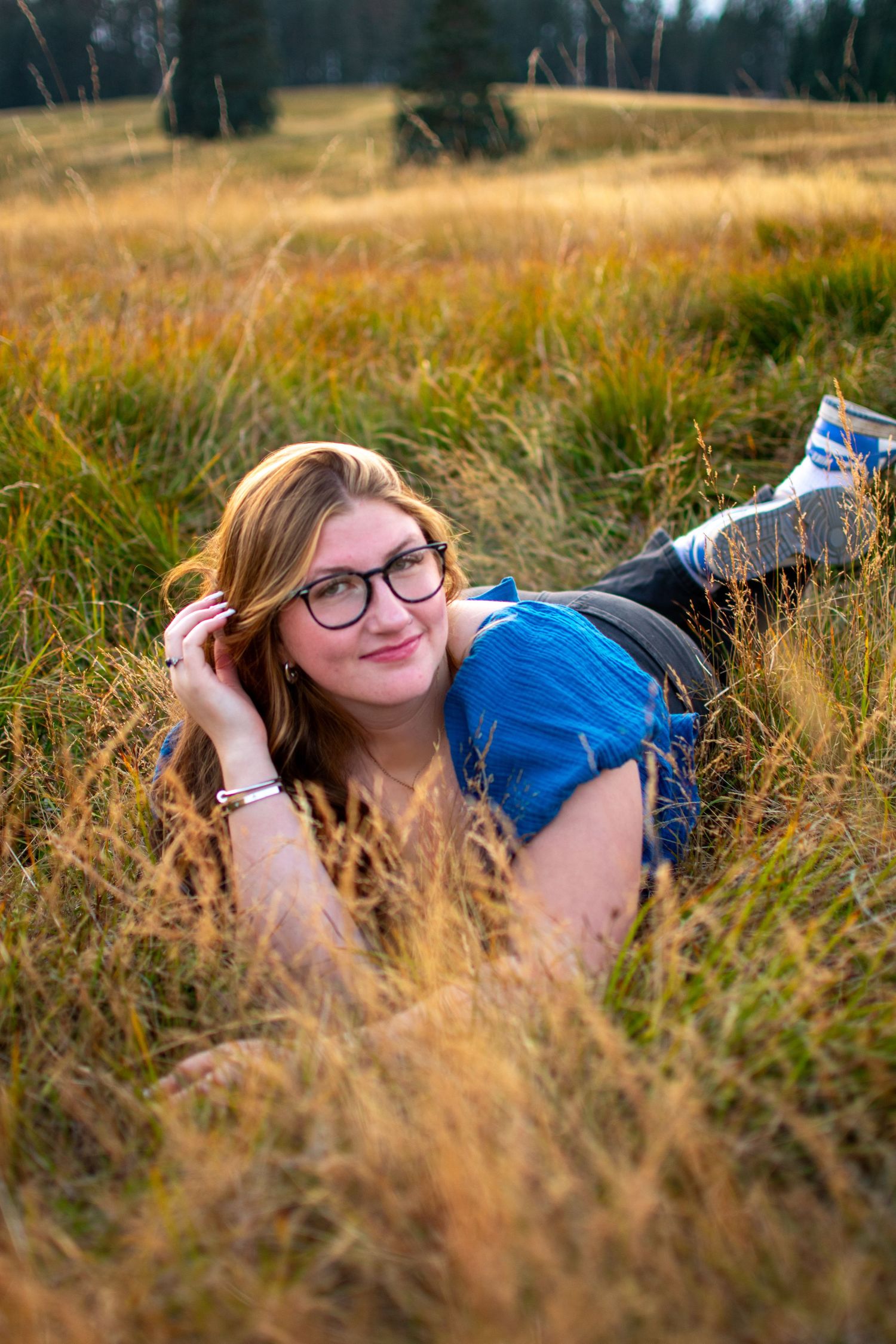 Senior portrait of girl in a field at Mary's Peak in Oregon.