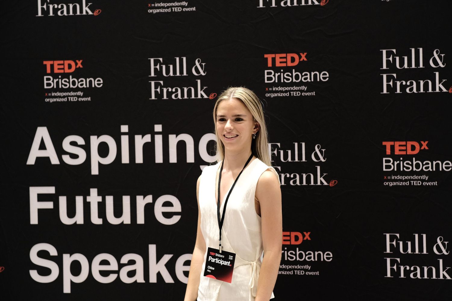 A woman posing in front of a 