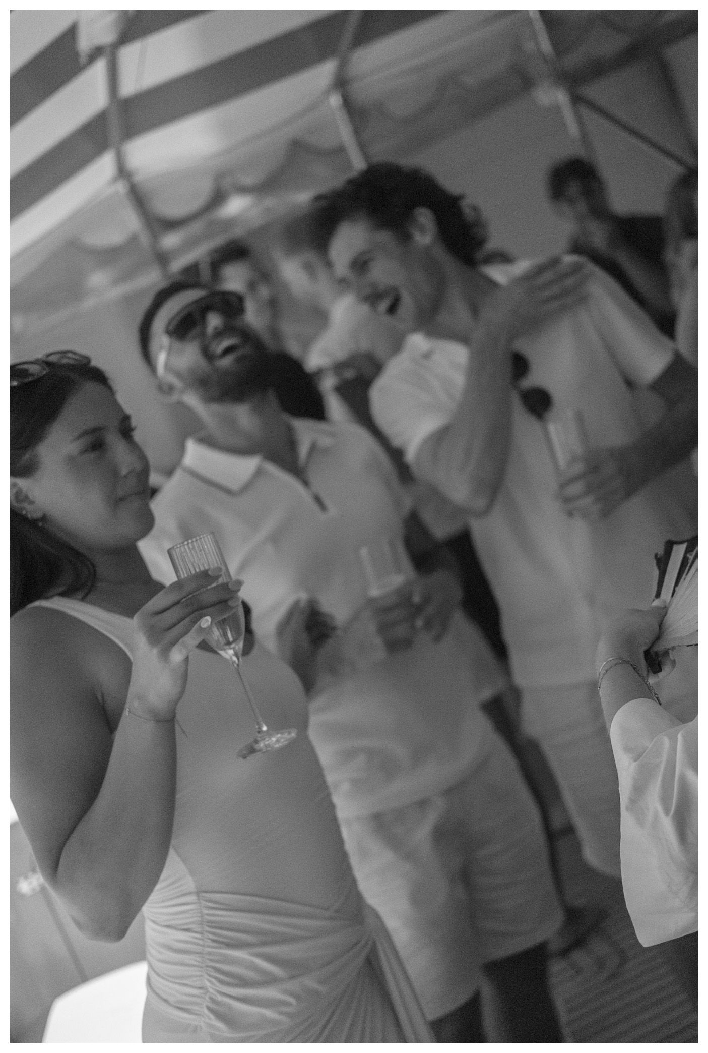 A monochrome portrait of a a woman and two men on the background.