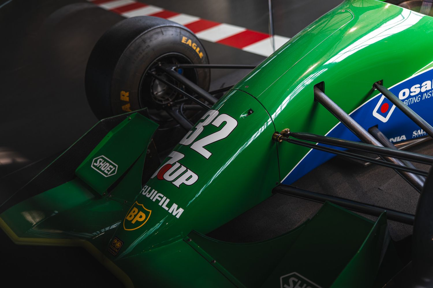 Green Jordan 192 Formula 1 car number 32 with Fujifilm sponsorship on display.
