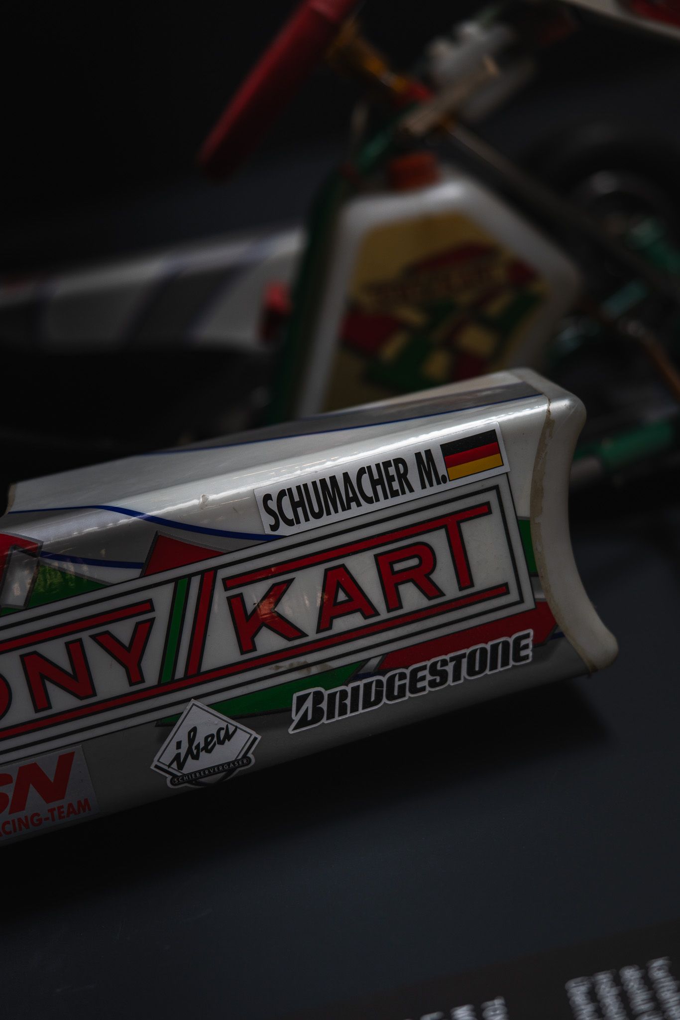 Michael Schumacher Tony Kart transponder with Bridgestone branding on display.