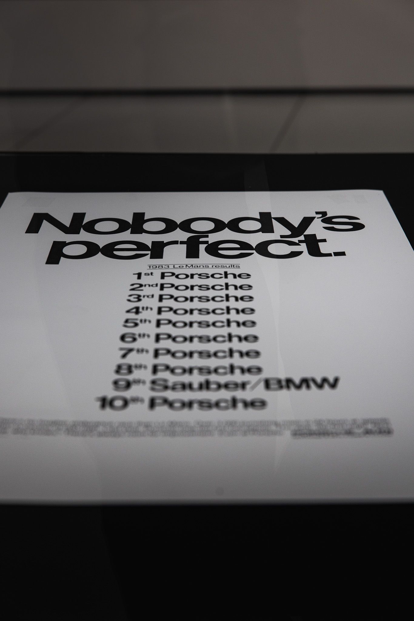 Humorous Porsche advertisement reading Nobody's perfect listing Le Mans race results dominated by Porsche.