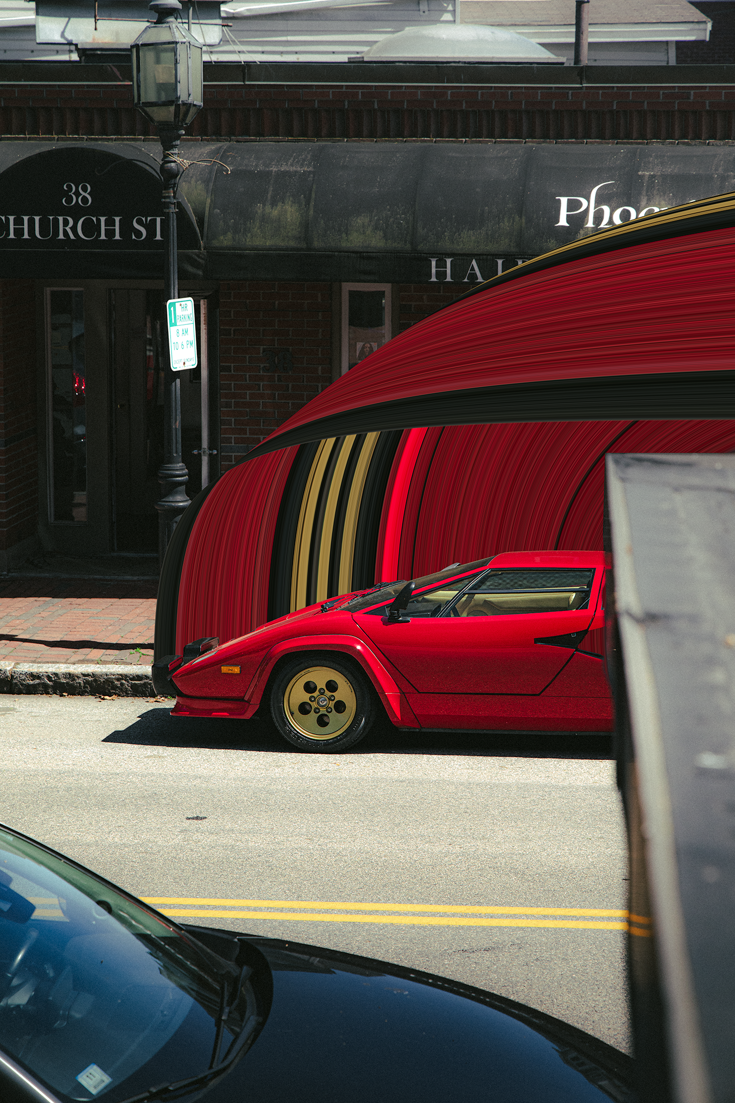 Red Lamborghini Countach parked on a street in front of a brick building at Church St.