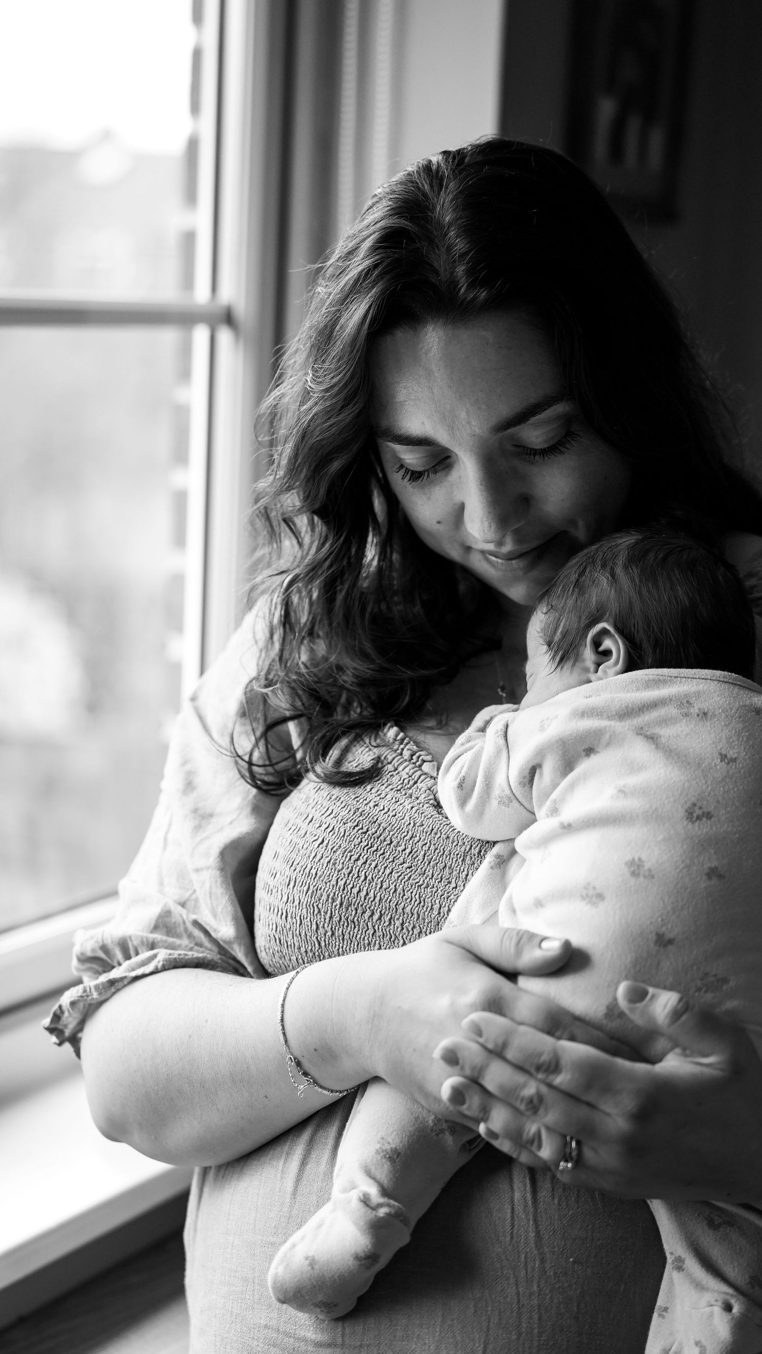 Newborn baby, at home, natural light photograph. Suffolk.