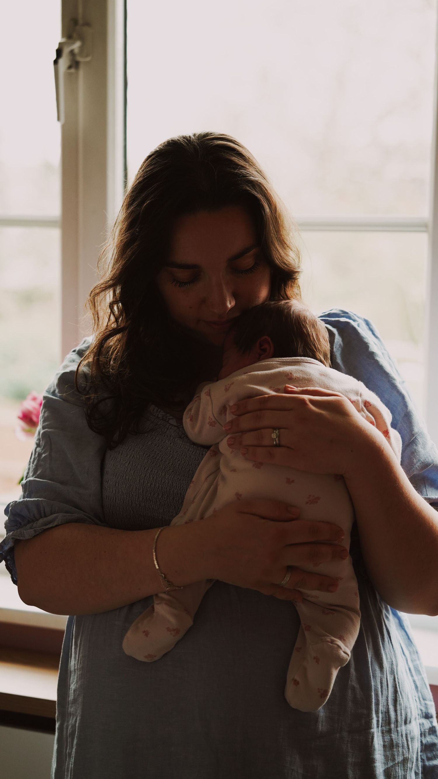 Newborn baby, at home, natural light photograph. Suffolk.