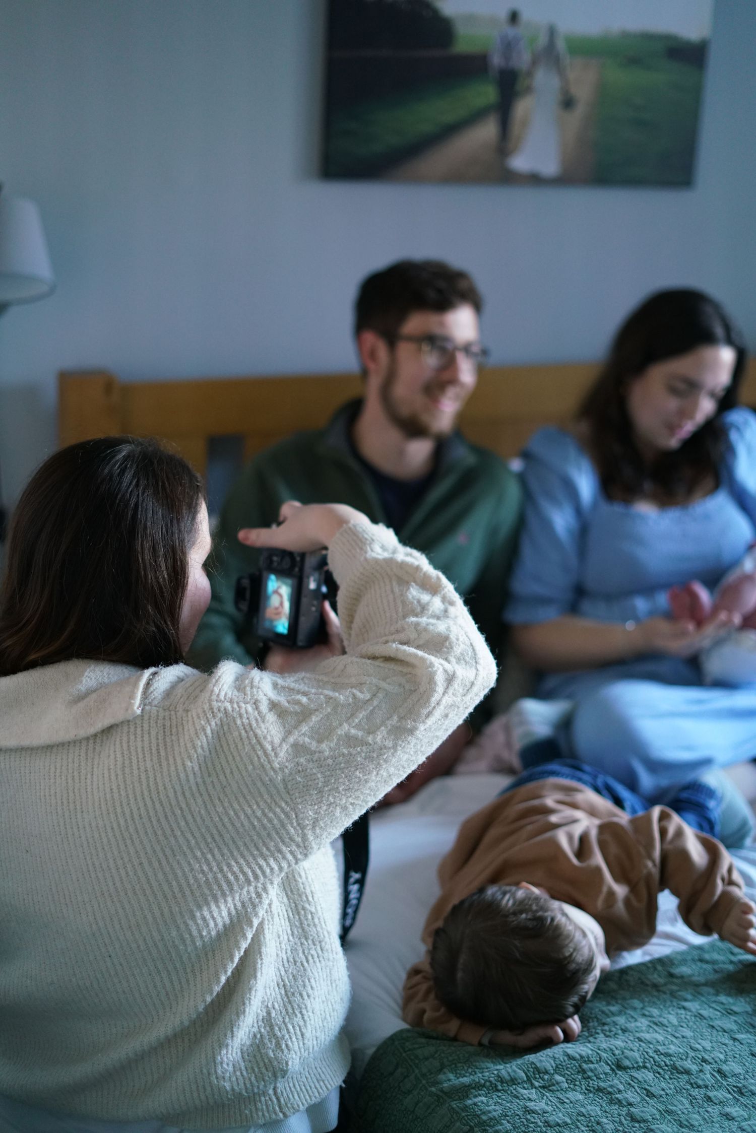 Behind the scenes. Photographer, photographing family in home, natural light in Suffolk.