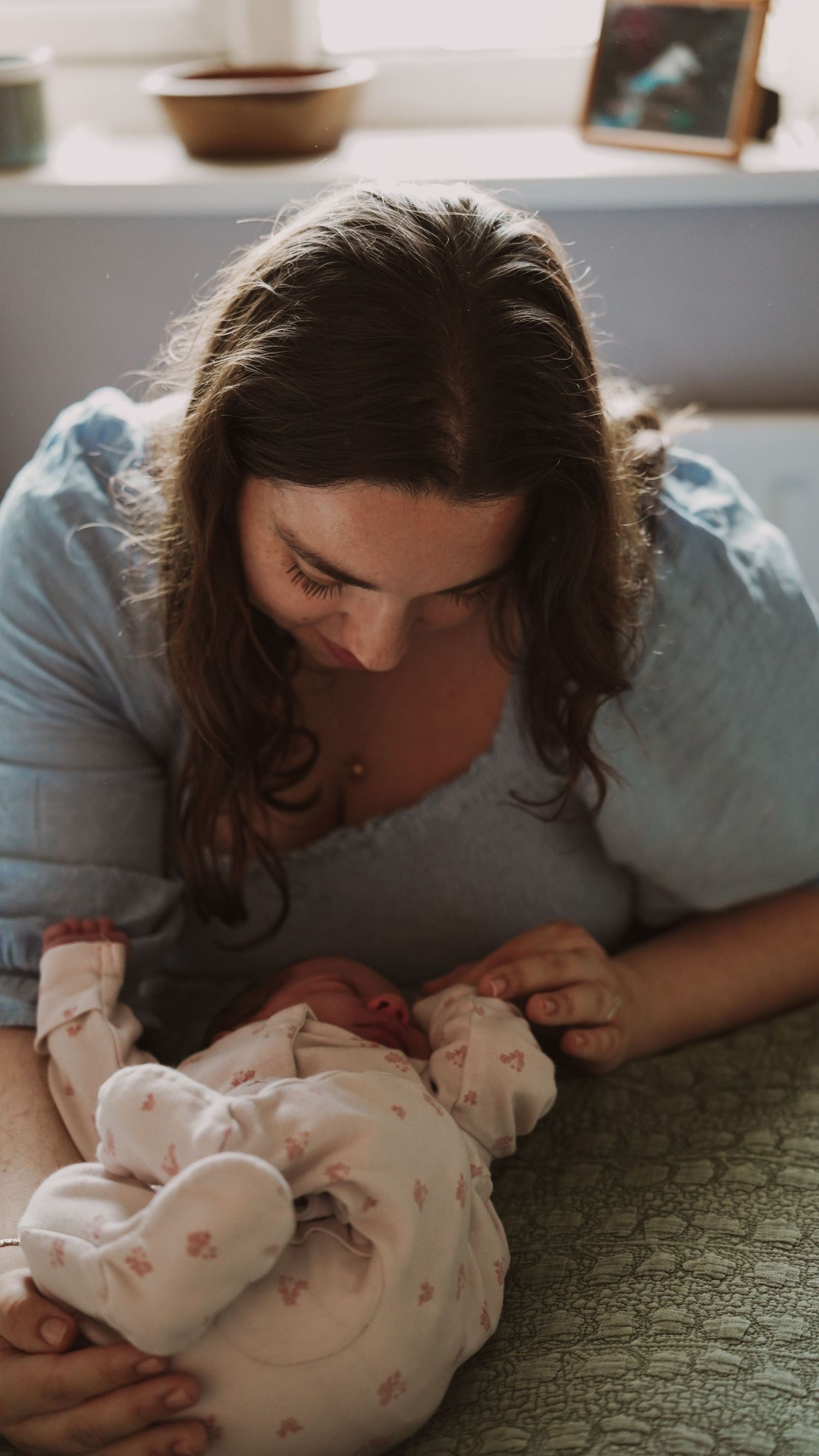 Newborn baby, at home, natural light photograph. Suffolk.