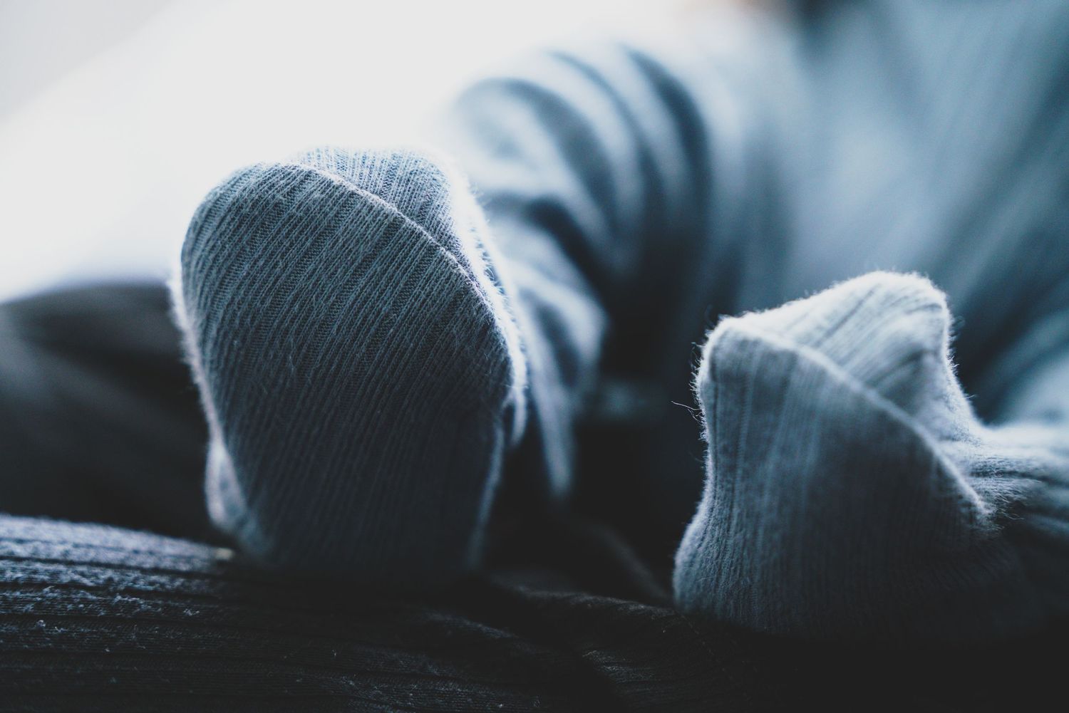 Newborn baby, at home, natural light photograph. Tiny feet.