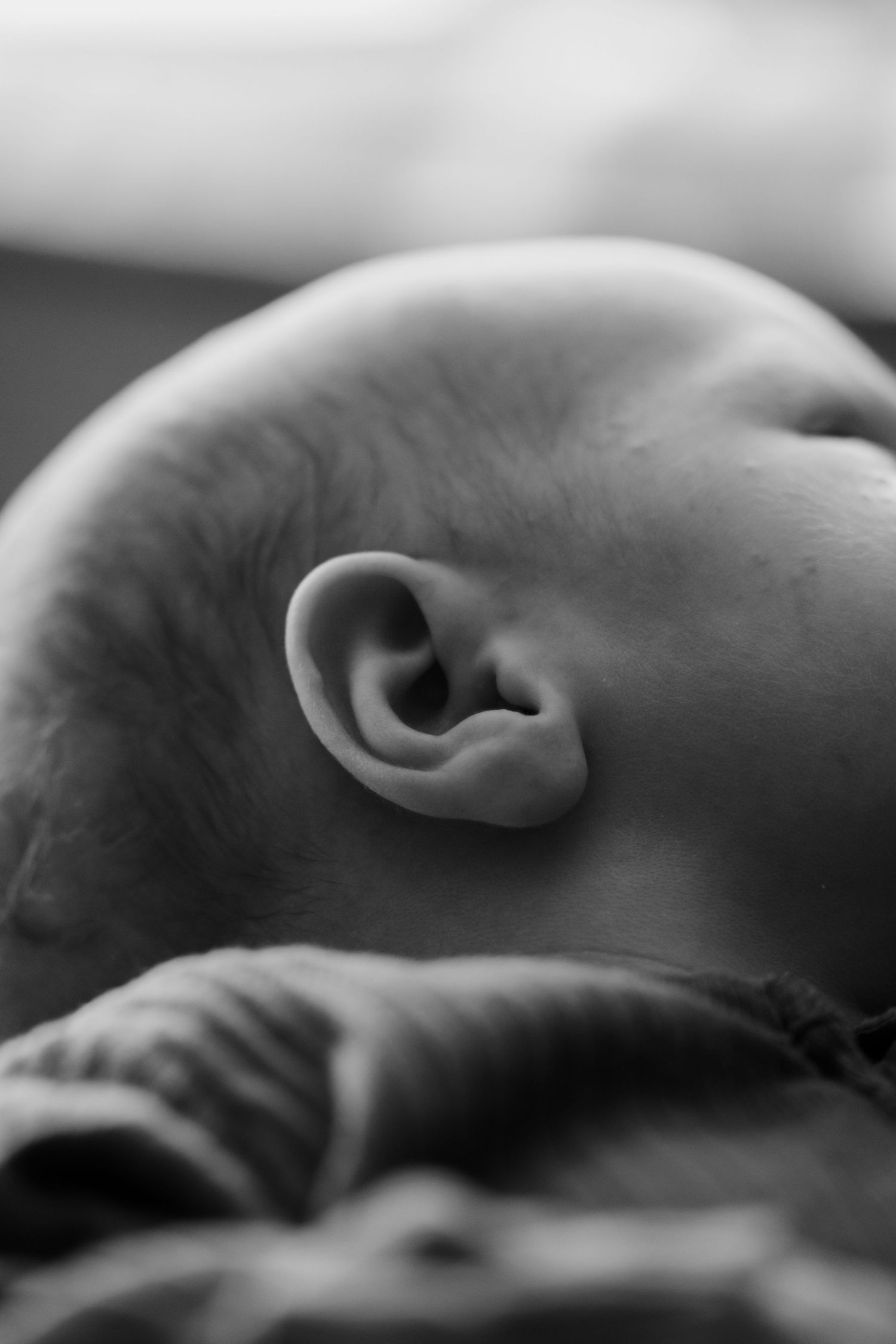 Newborn baby, at home, natural light photograph.