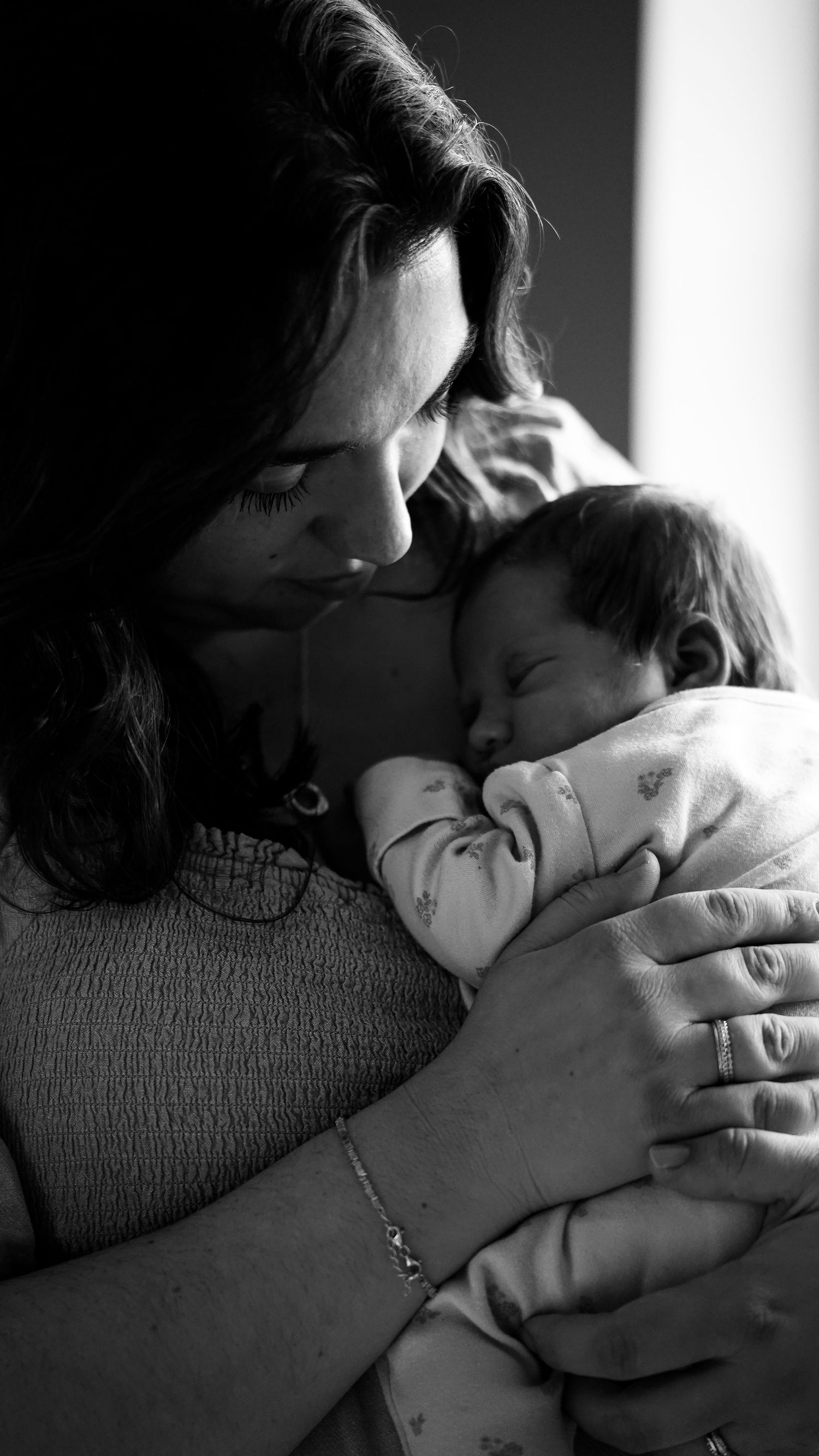 Newborn baby, at home, natural light photograph. Suffolk.