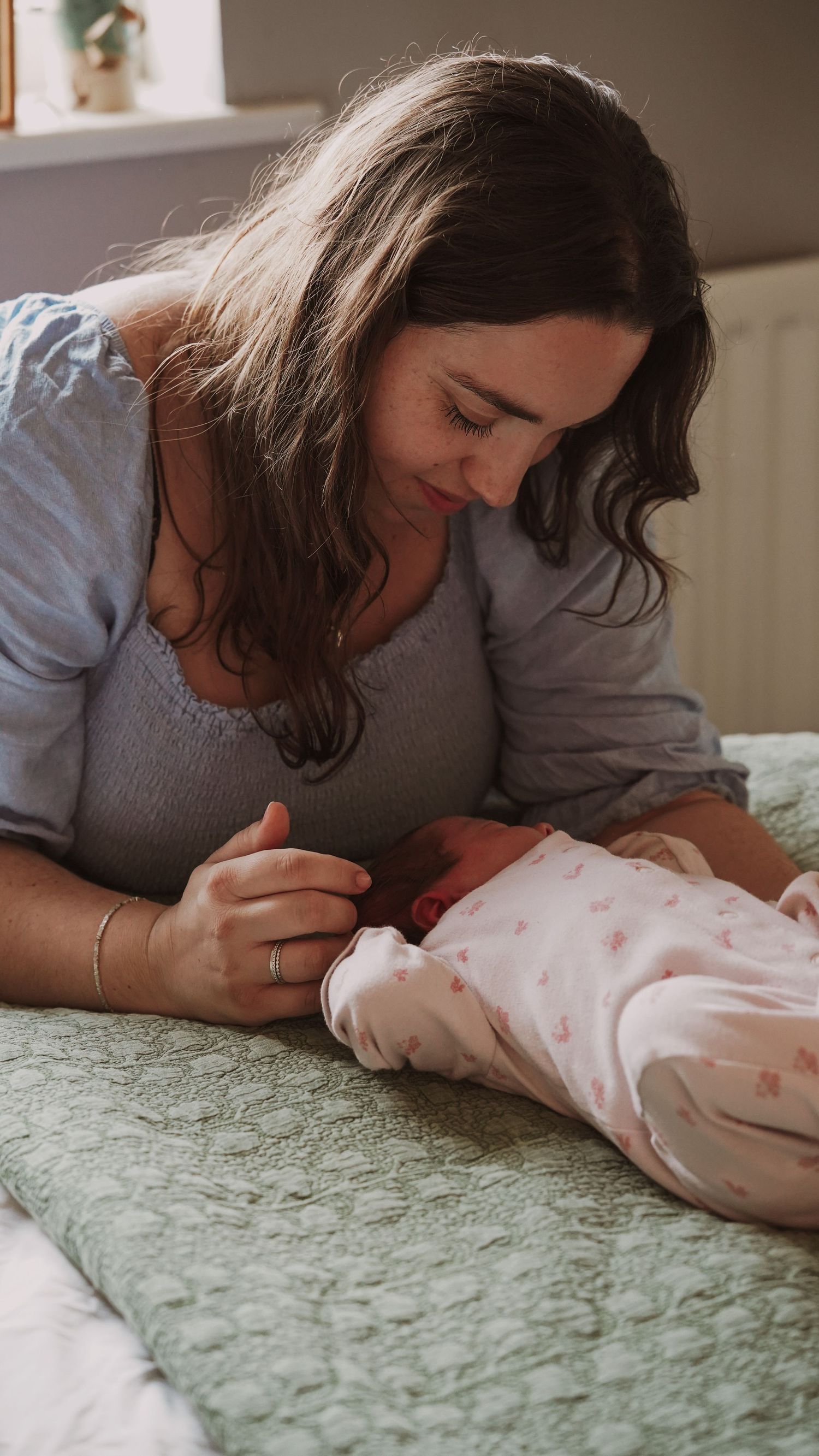 Newborn baby, at home, natural light photograph. Suffolk.