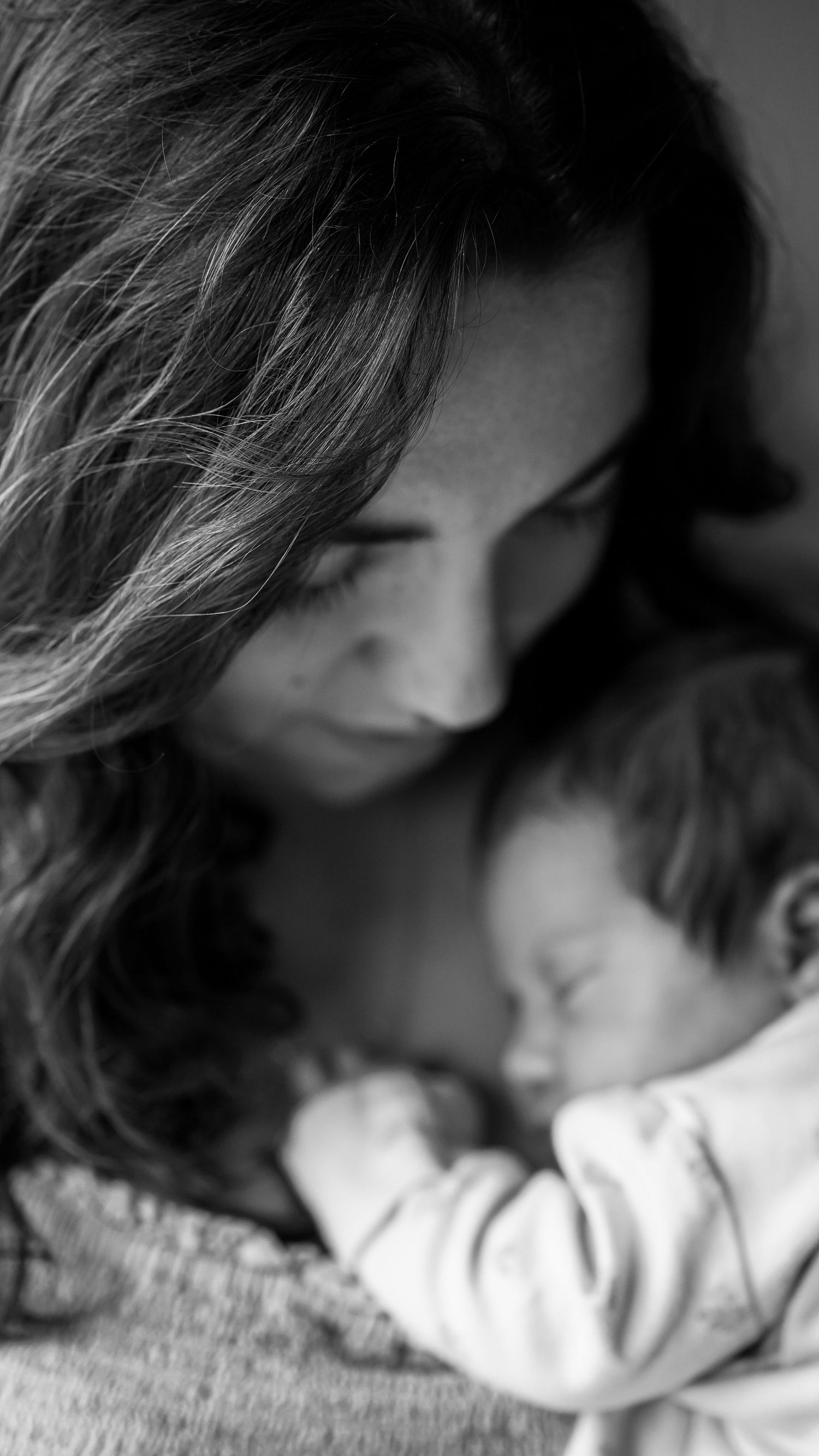 Newborn baby, at home, natural light photograph. Suffolk.