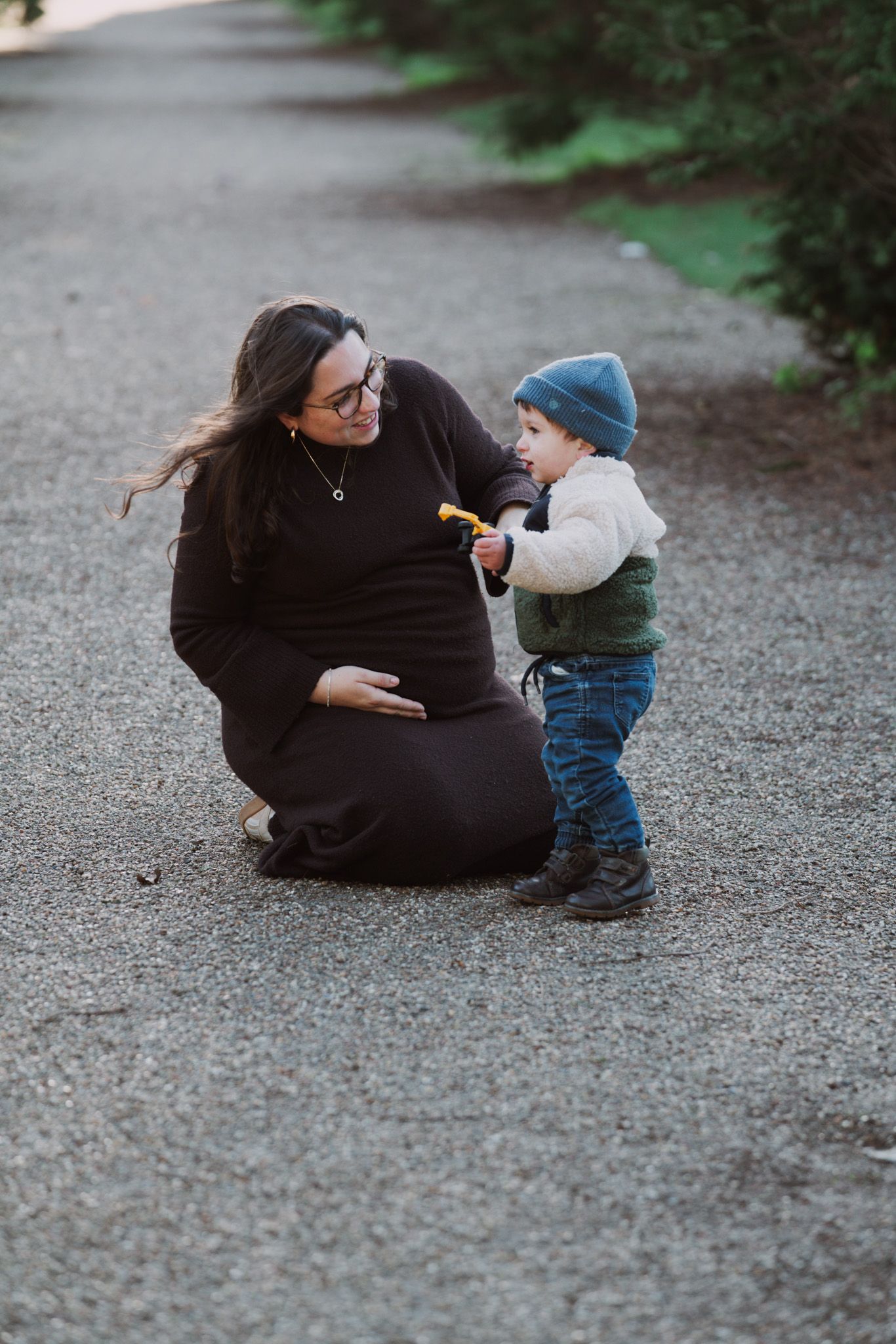 Natural light, outdoor family and maternity photos in Suffolk. Pregnant mother and child.