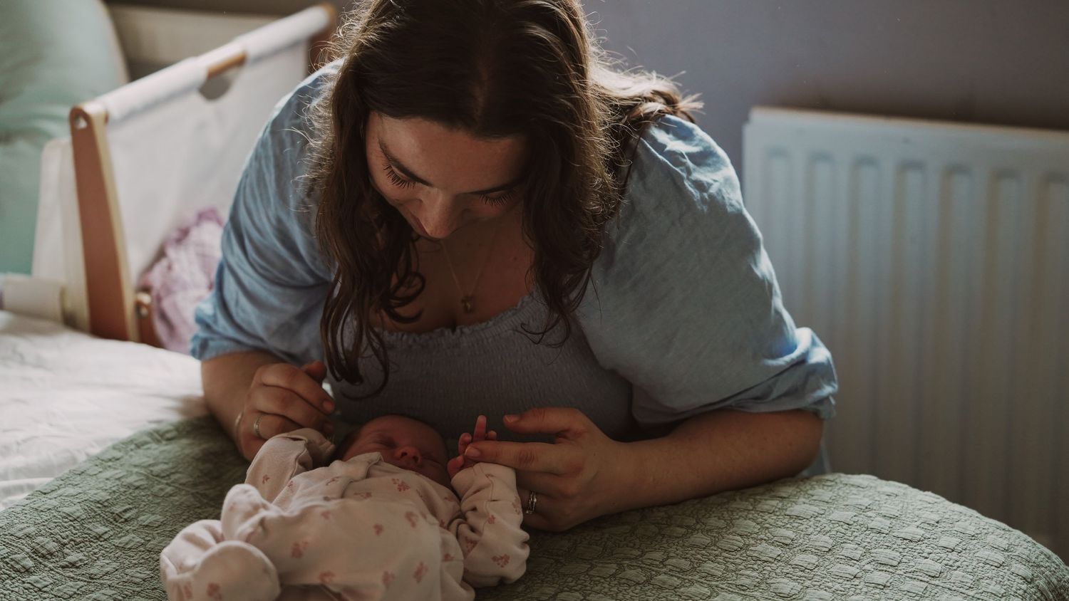 Newborn baby, at home, natural light photograph. Suffolk.