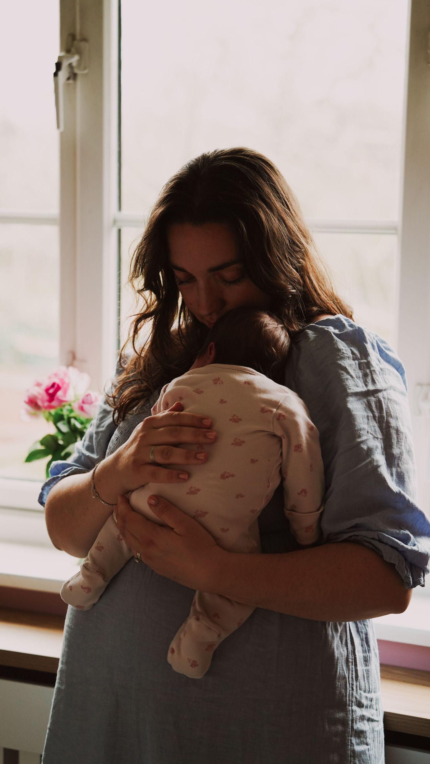 Newborn baby, at home, natural light photograph. Suffolk.