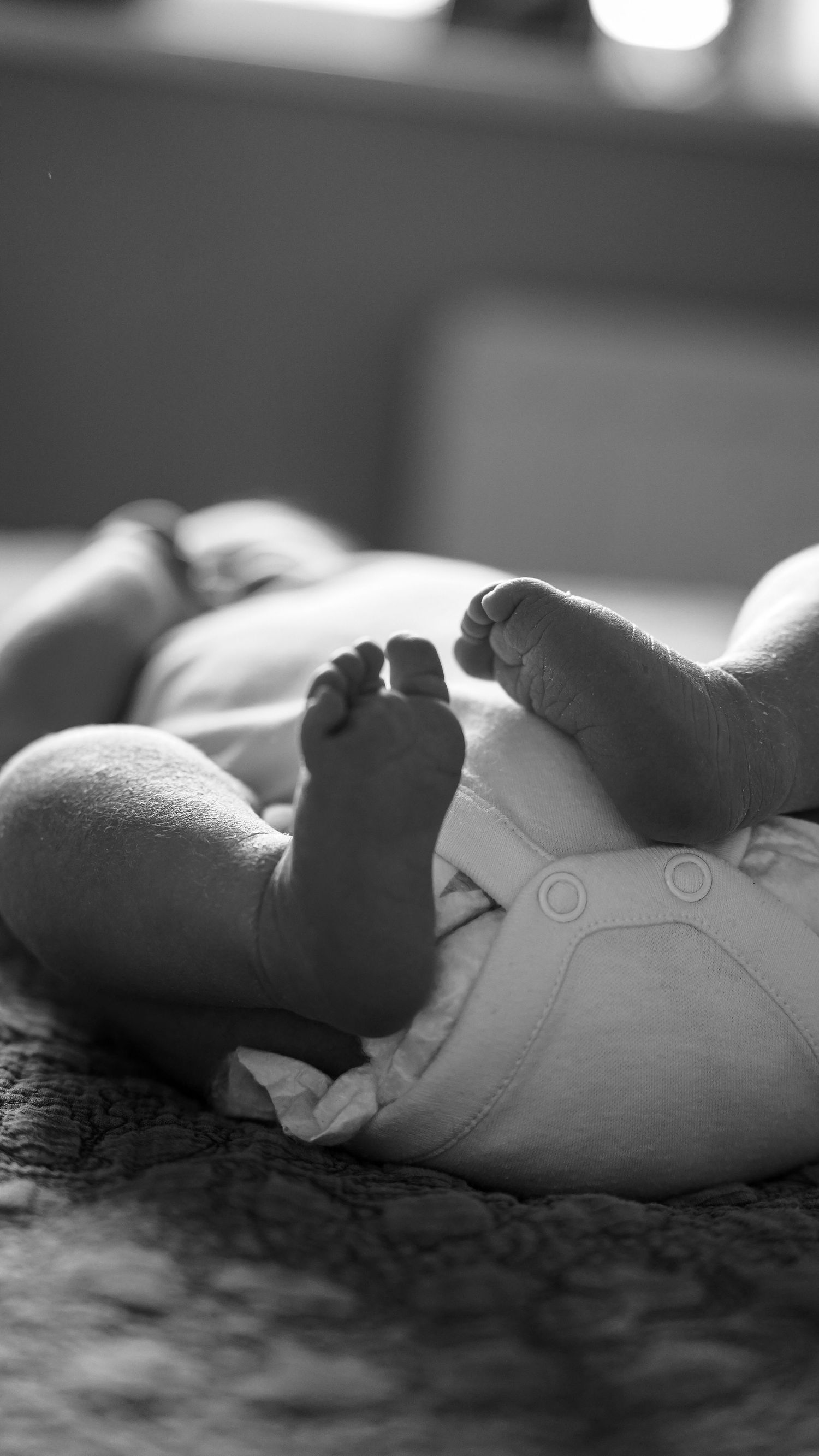 Newborn baby, at home, natural light photograph. Suffolk.
