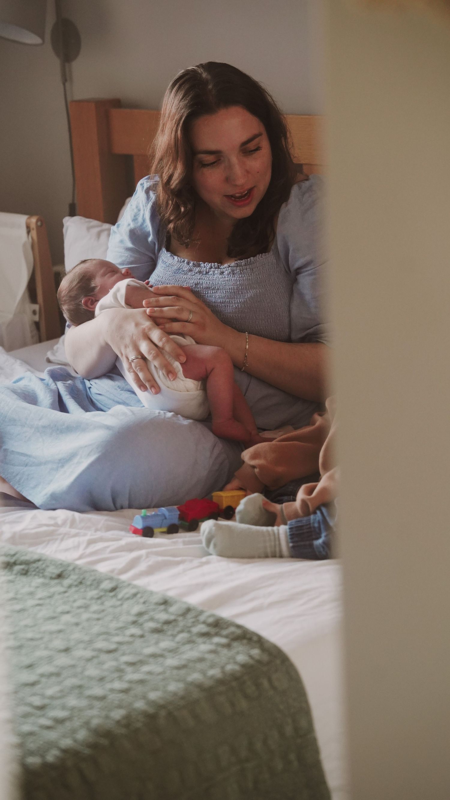Newborn baby, at home, natural light photograph. Suffolk.