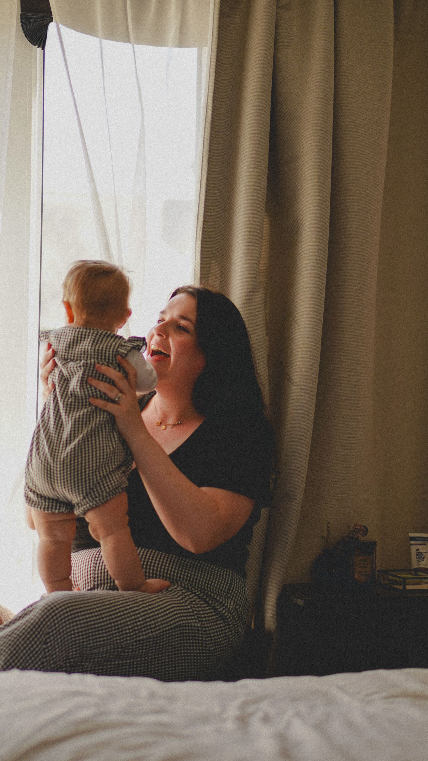 Mother and baby, natural light photograph. Suffolk. At home.