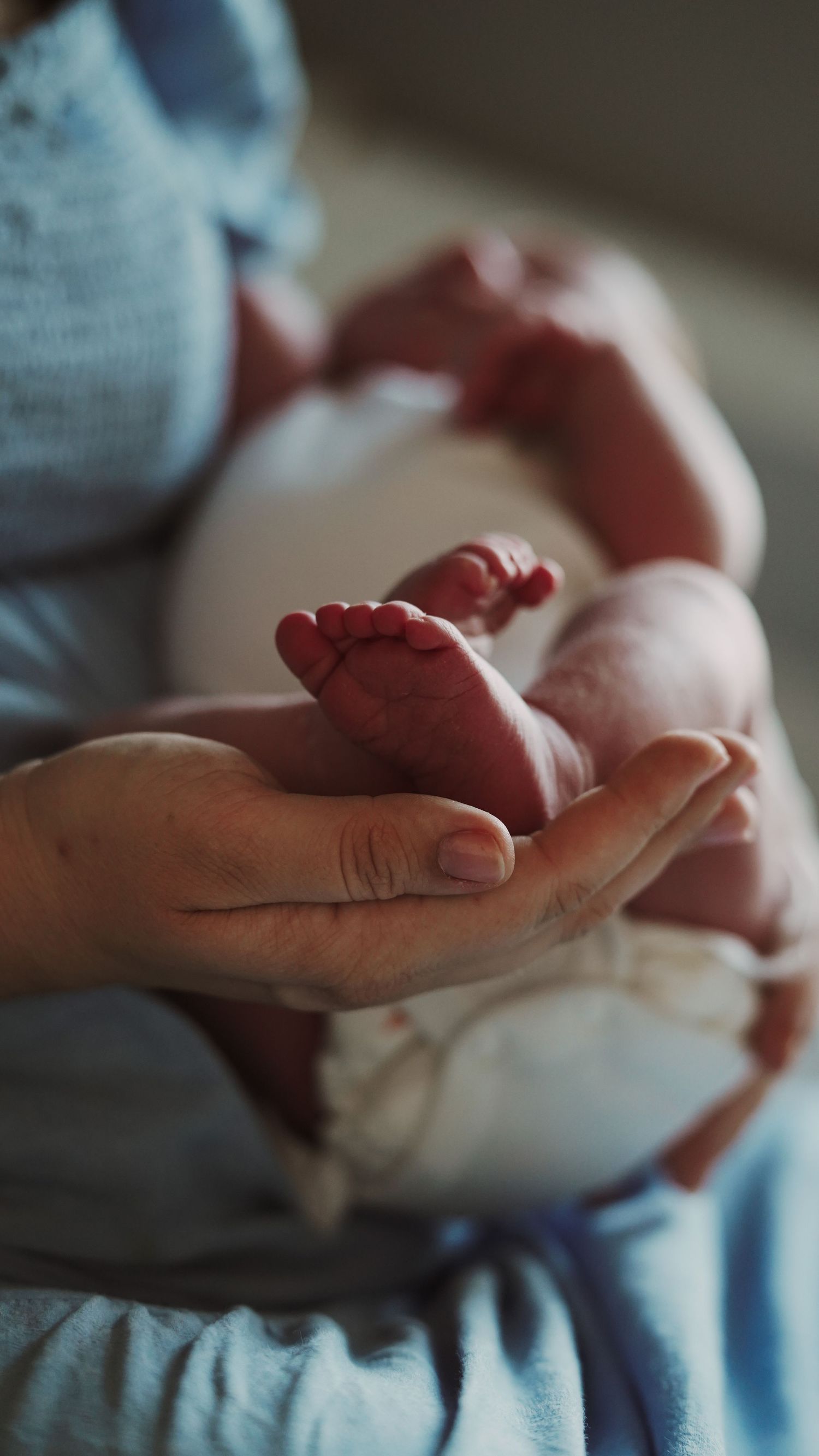 Newborn baby, at home, natural light photograph. Suffolk.