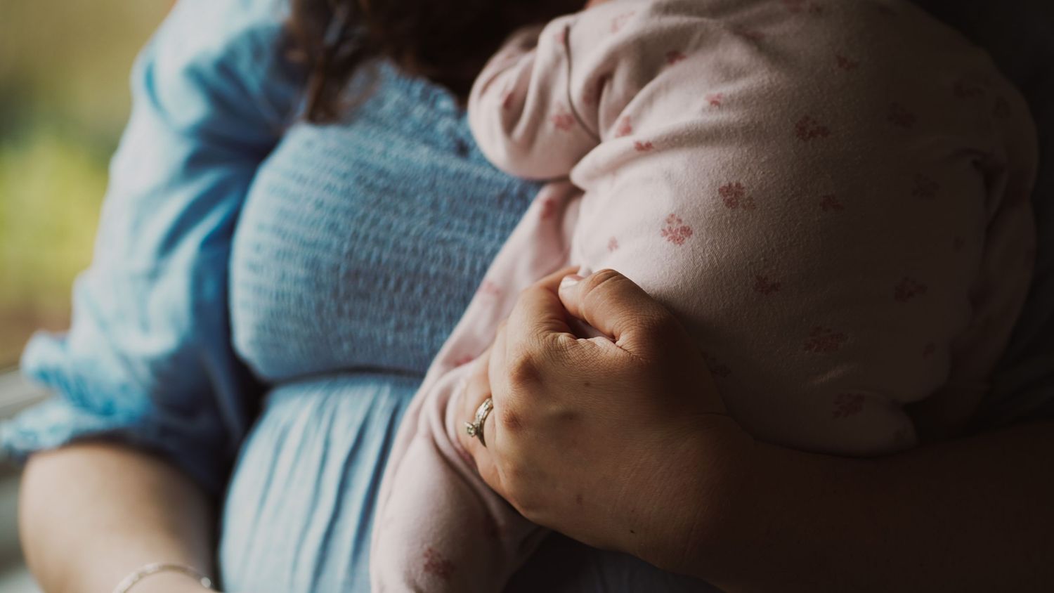 Newborn baby, at home, natural light photograph. Suffolk.
