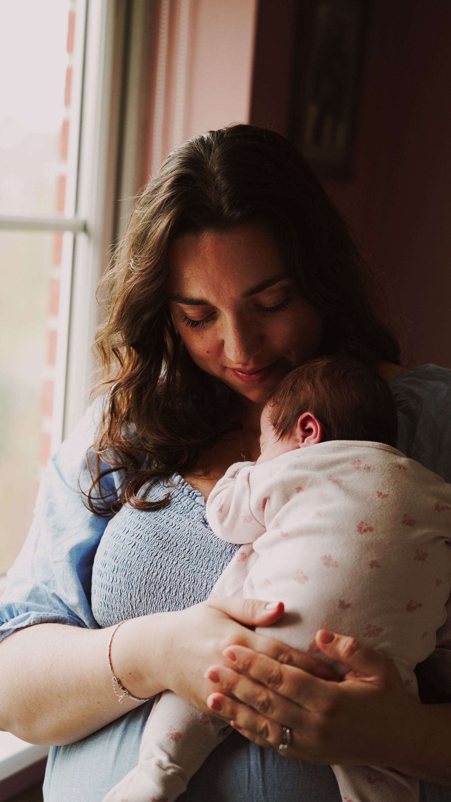Newborn baby, at home, natural light photograph. Suffolk.