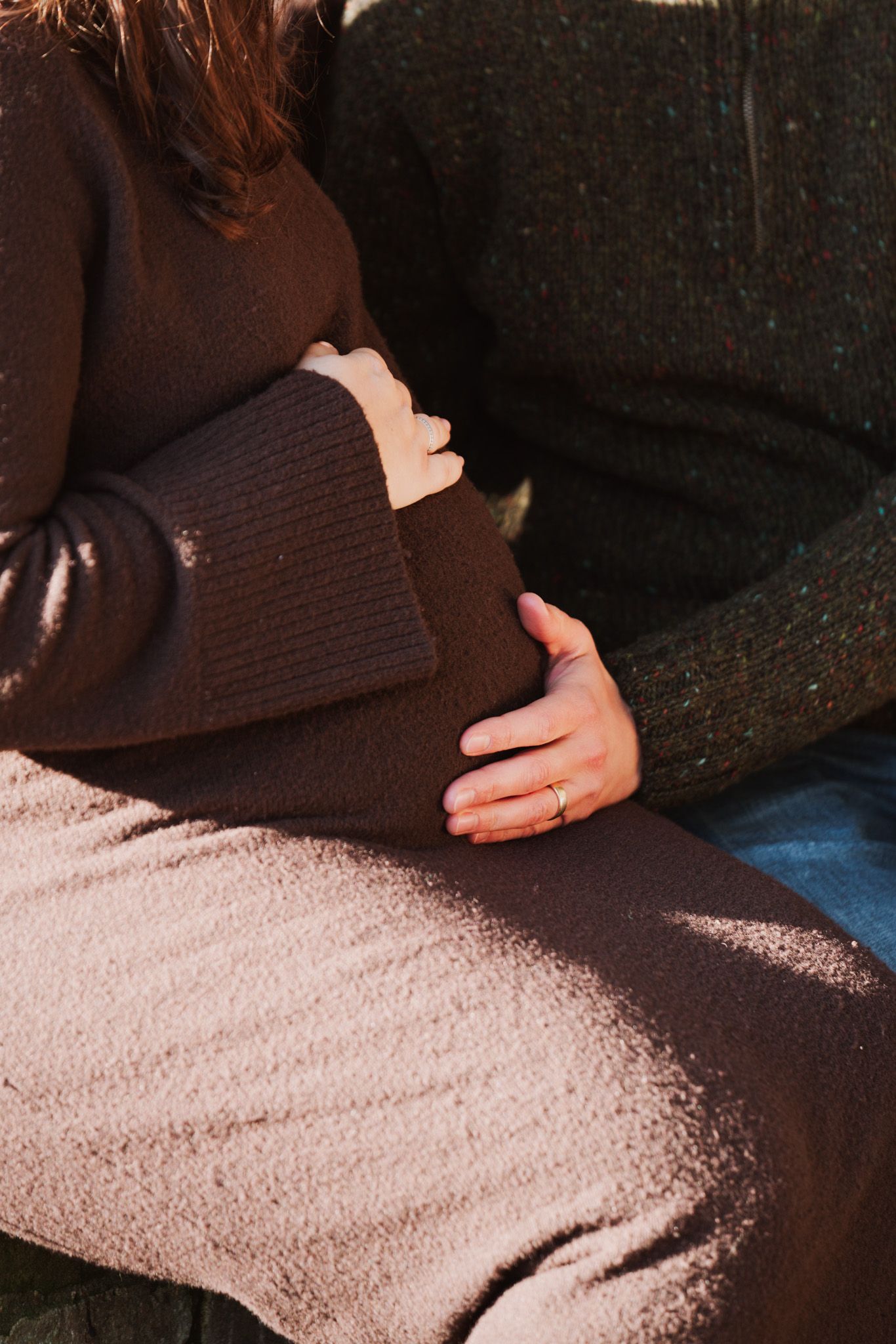 Natural light, outdoor family and maternity photos in Suffolk. Pregnant mother's bump and partner.