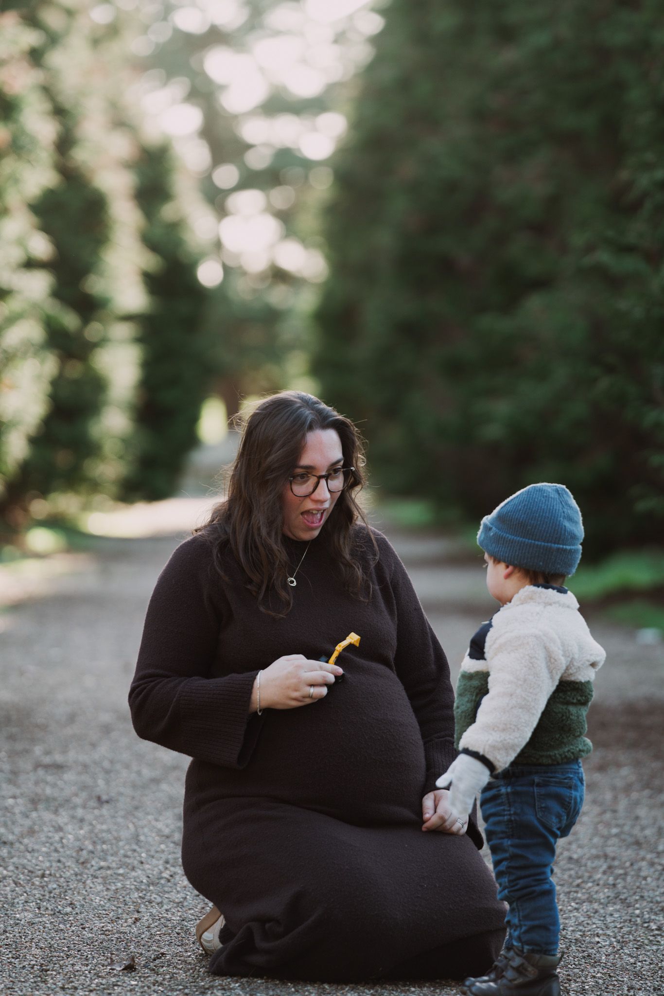 Natural light, outdoor family and maternity photos in Suffolk. Pregnant mother and child.