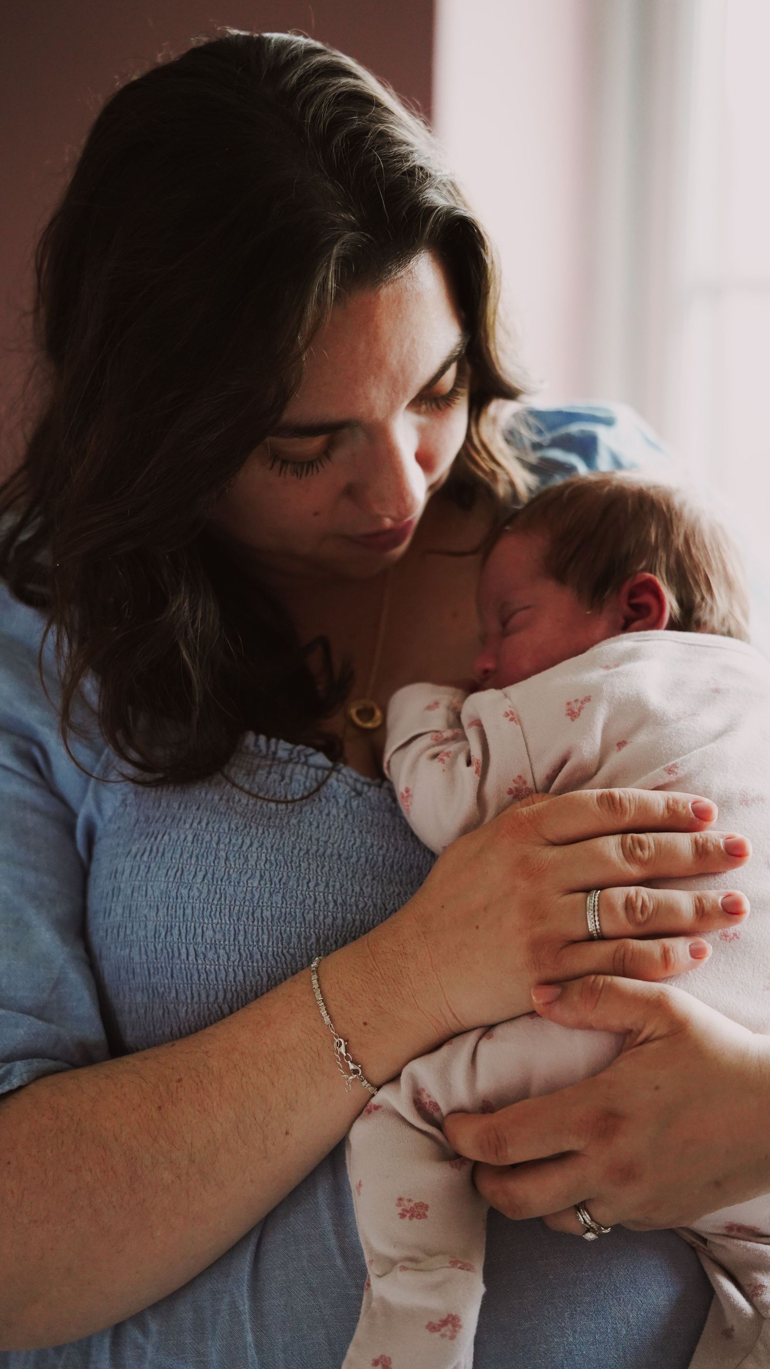 Newborn baby, at home, natural light photograph. Suffolk.