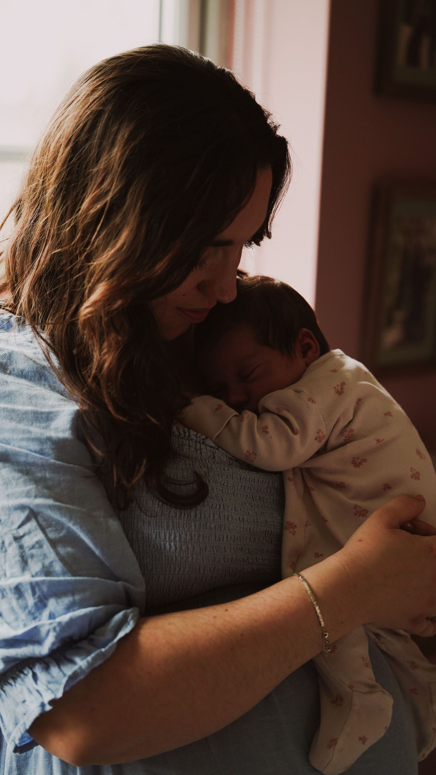 Newborn baby, at home, natural light photograph. Suffolk.