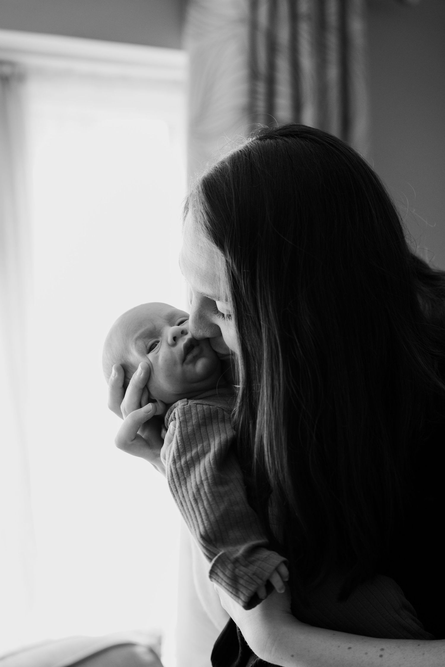 Newborn baby, at home, natural light photograph.