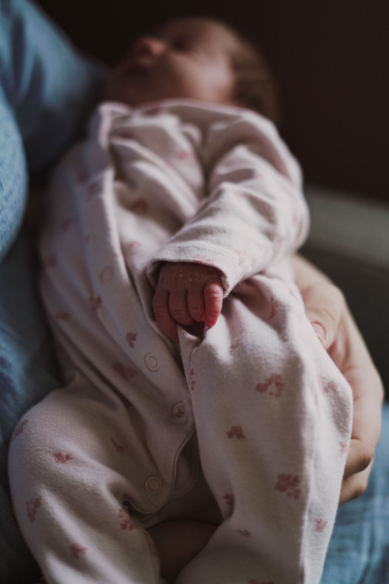 Newborn baby, at home, natural light photograph. Suffolk.