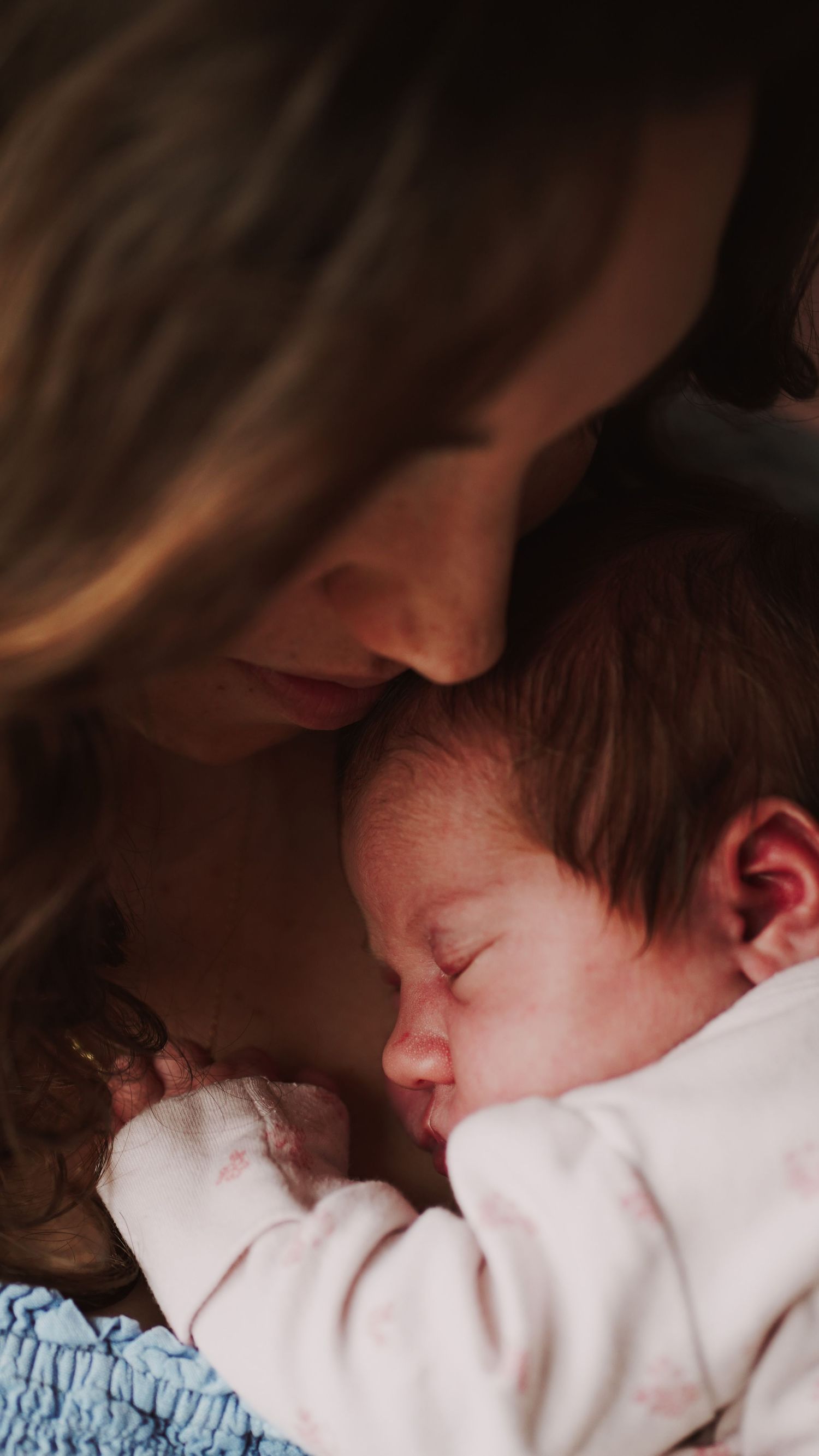 Newborn baby, at home, natural light photograph. Suffolk.