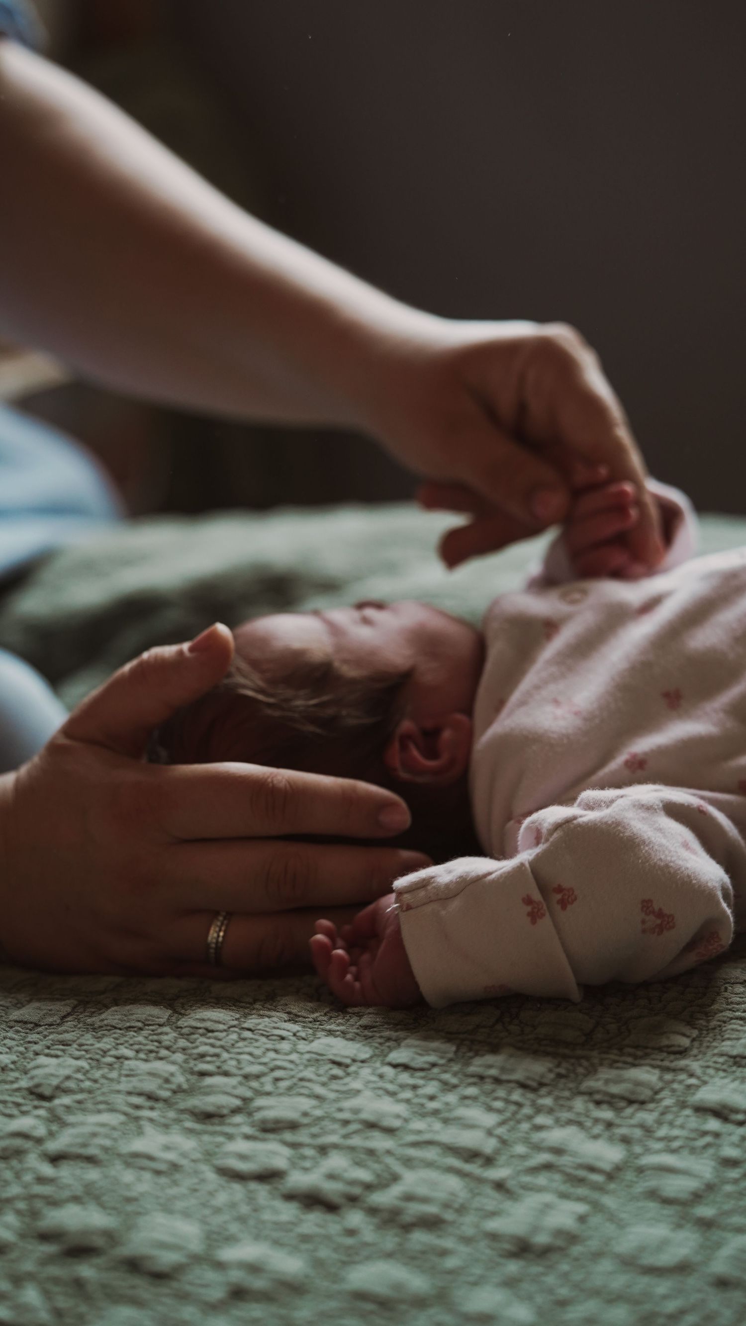 Newborn baby, at home, natural light photograph. Suffolk.