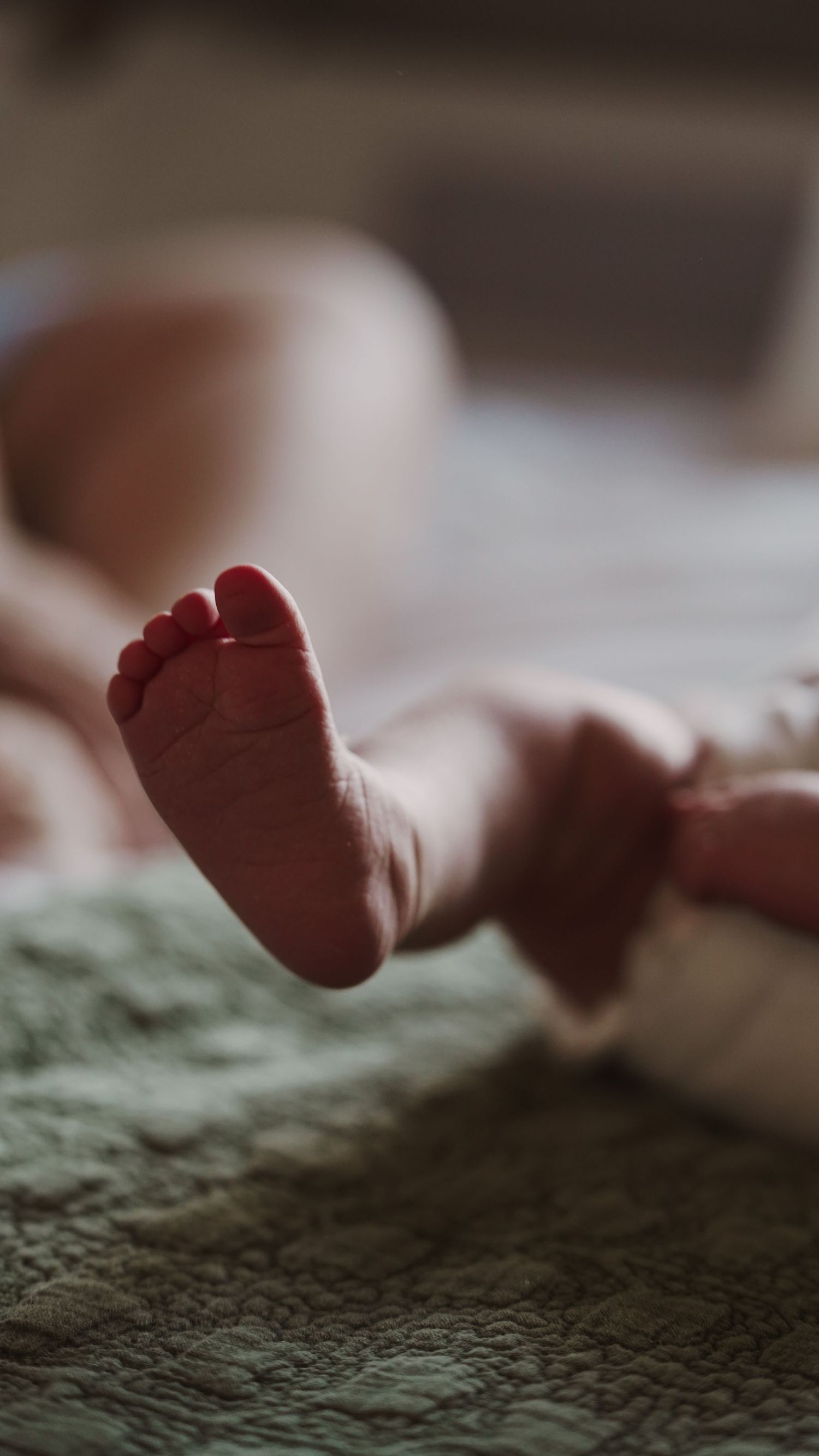 Newborn baby, at home, natural light photograph. Suffolk.