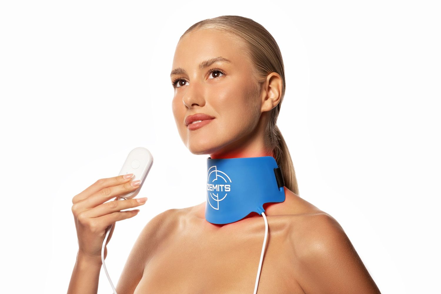 Woman wearing a blue neck therapy wrap device with wired controller for pain relief and muscle recovery.