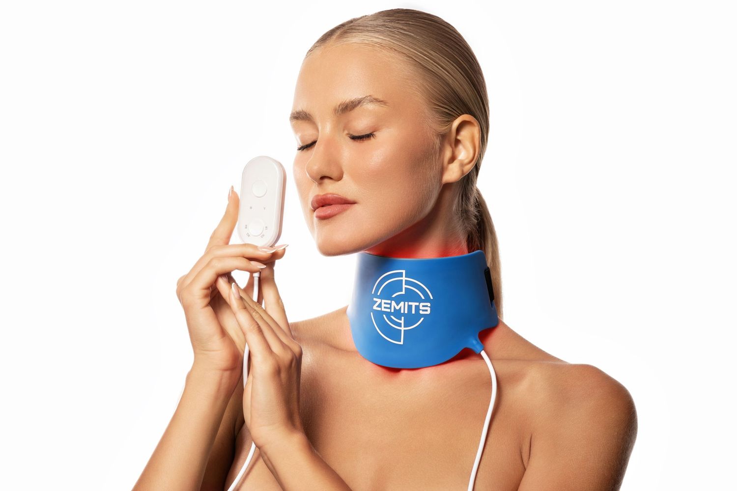 Woman wearing a blue Zemits neck therapy collar device, holding a white accessory with eyes closed.