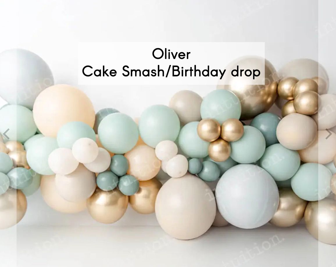 Oliver cake smash birthday drop backdrop featuring sage green, gold, cream, and white balloon garland arrangement.