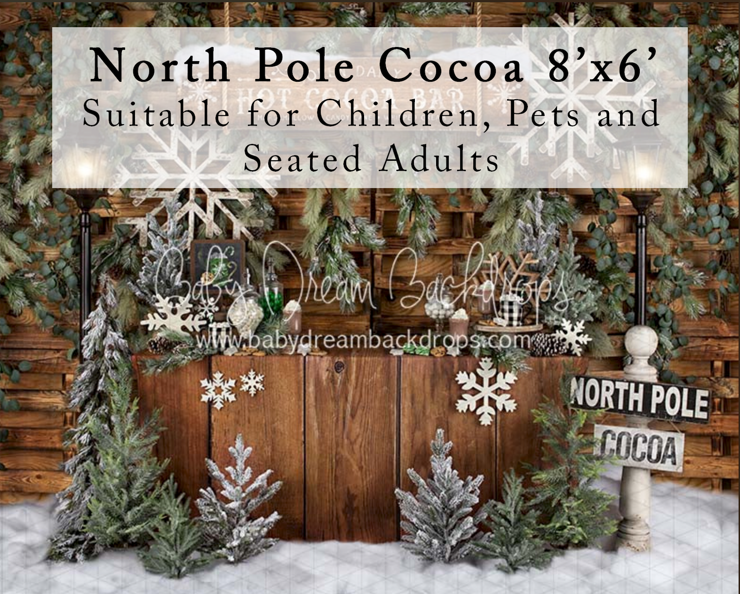 North Pole Cocoa 8x6 photography backdrop with snowy Christmas trees, wooden fence, and festive holiday decorations.