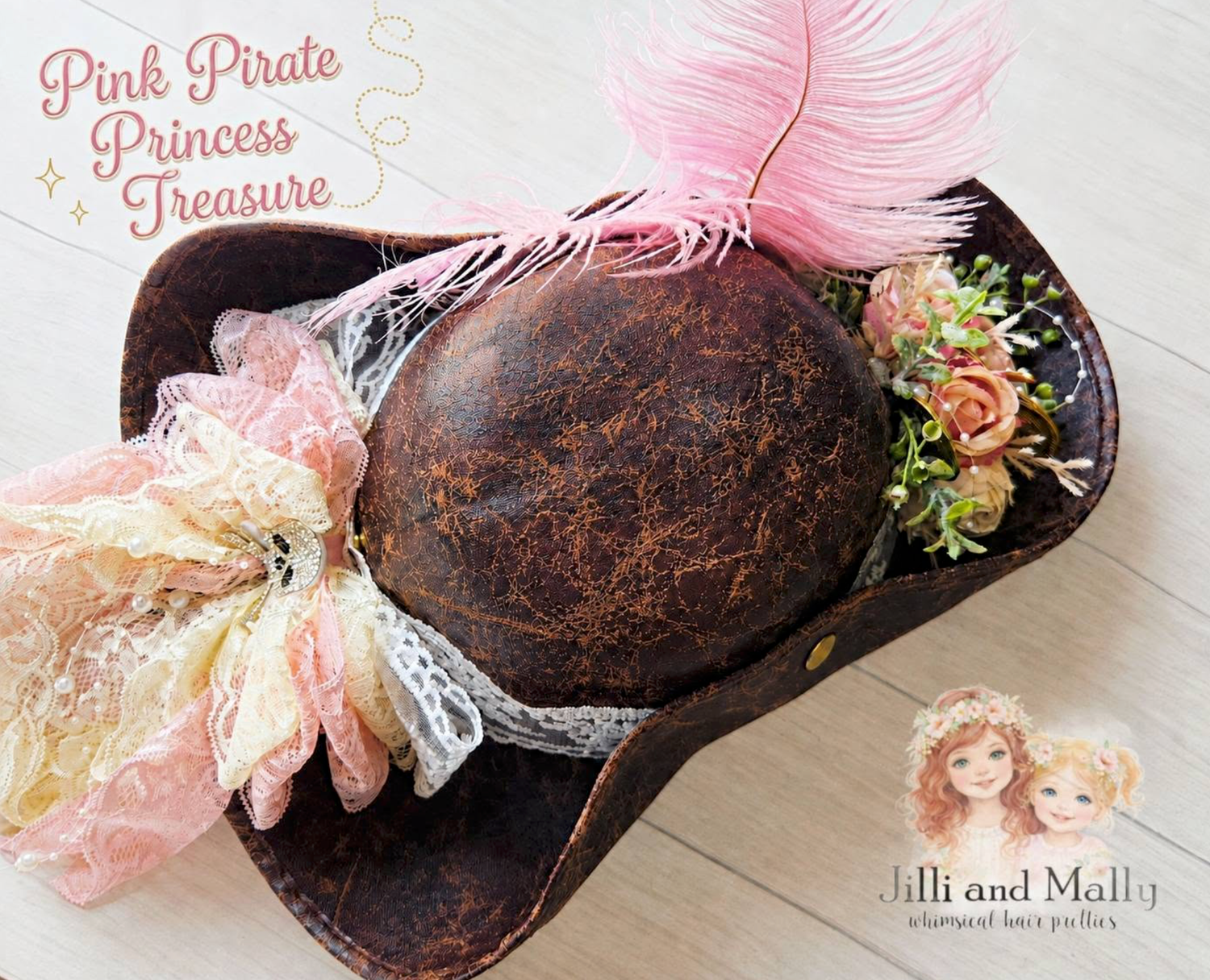 Pink pirate princess treasure hat with pink feathers, lace, and floral decorations by Jilli and Mally.