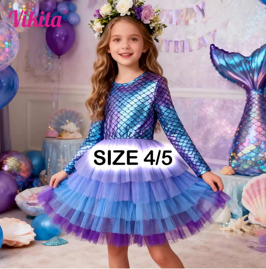 Girl wearing a mermaid-themed size 4/5 tulle dress with iridescent scales top and purple layered skirt at a birthday party.