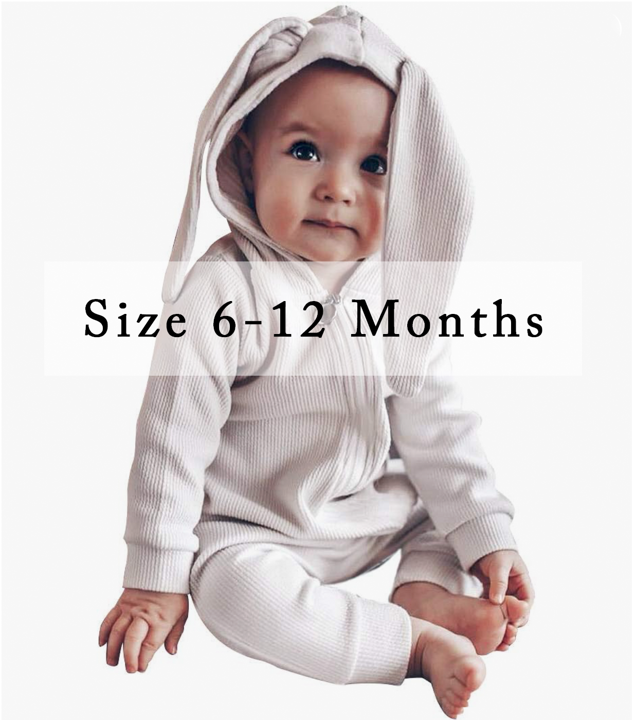 Baby wearing a cream ribbed hooded bunny ear romper, size 6-12 months.