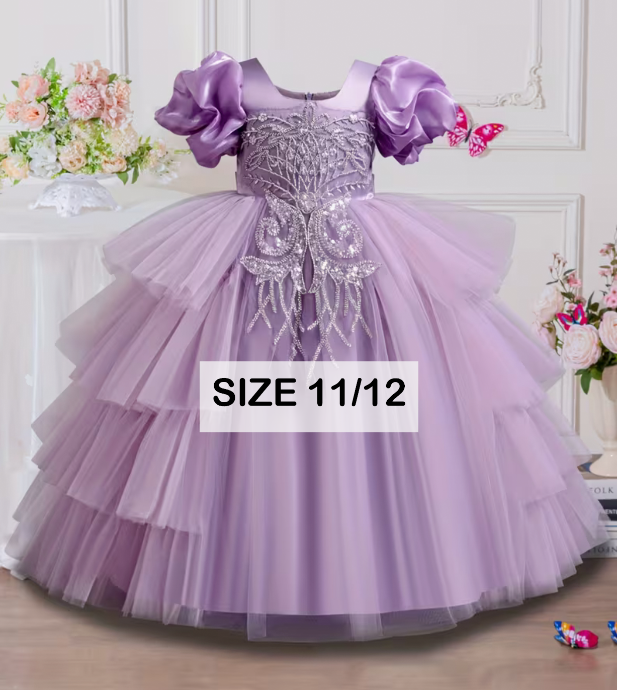 Girls lavender tulle ball gown size 11/12 with puff sleeves, beaded bodice, and layered skirt for special occasions.
