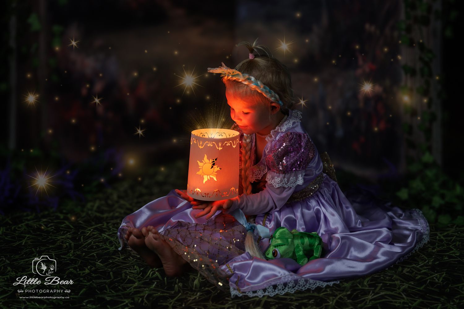 A child in a purple fairy dress holds a glowing lantern with sparkles in a magical garden setting.