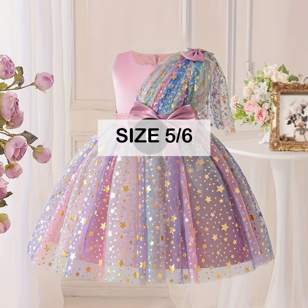 Girls size 5/6 rainbow tulle party dress with gold star sequins, pink bodice, and colorful bow shoulder detail.