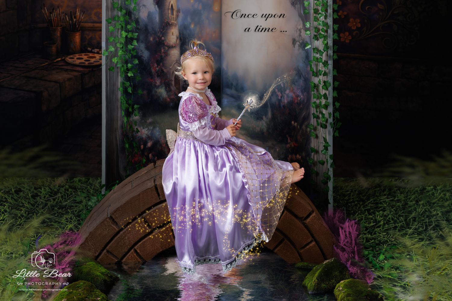 Young girl in purple Rapunzel princess dress sits on stone bridge with magic wand in enchanted fairy tale forest setting.