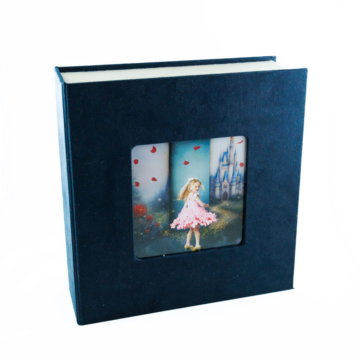 Dark navy blue hardcover photo album with fairy tale princess castle image in center window.