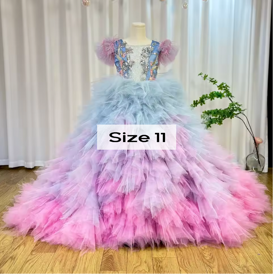 Size 11 girls rainbow tulle ball gown with blue pink ombre ruffles and floral embellished bodice.