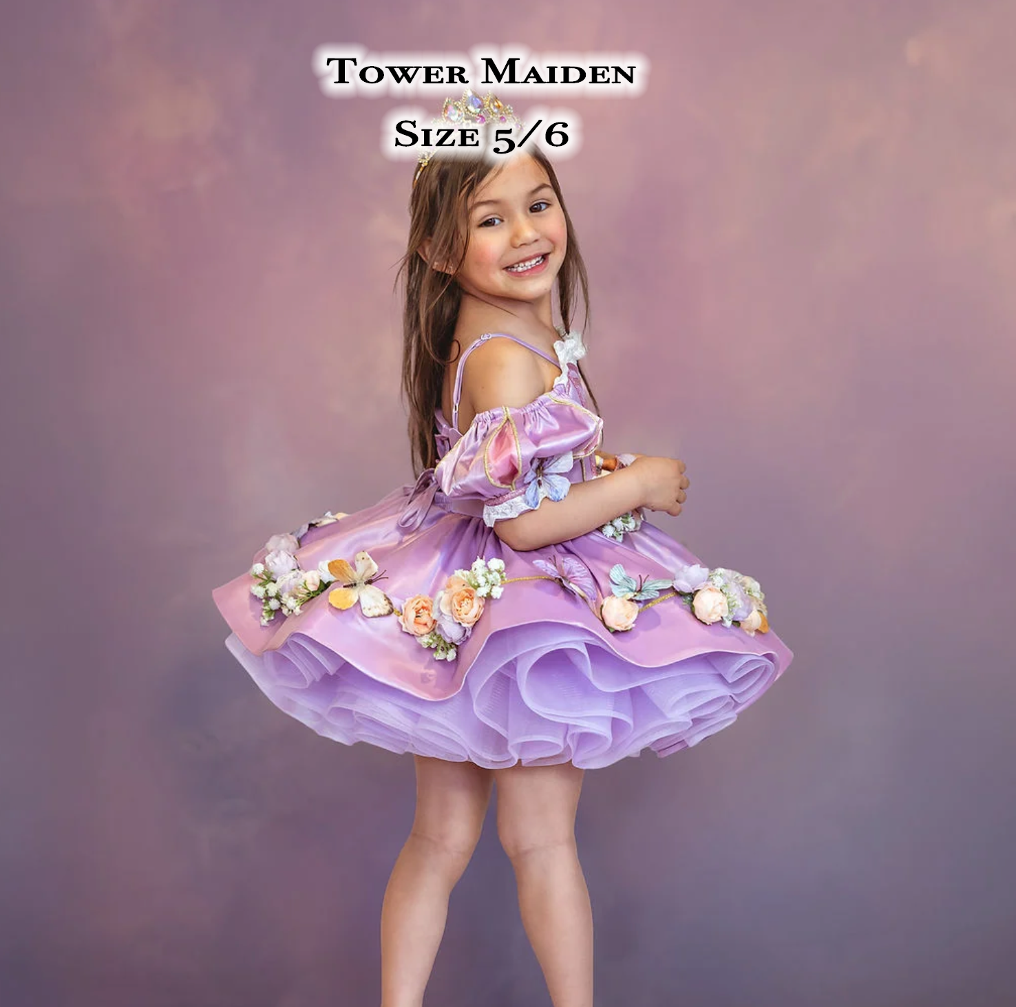 Young girl in lavender Tower Maiden ruffle dress with floral accents, size 5/6, posing against a purple backdrop.